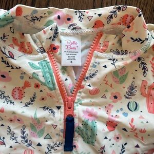 Ruffle Butts Cream Rashguard with Coral and Mint